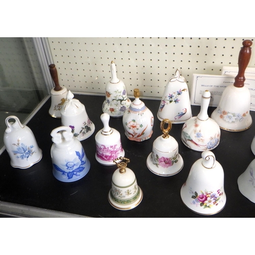 87 - A collection of Bells Of The World's Great Porcelain Houses together with a display shelf. (29)