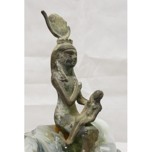 297 - A statue of the Egyptian Goddess Isis nursing her son Horus, cast bronze on a crystallised throne / ... 