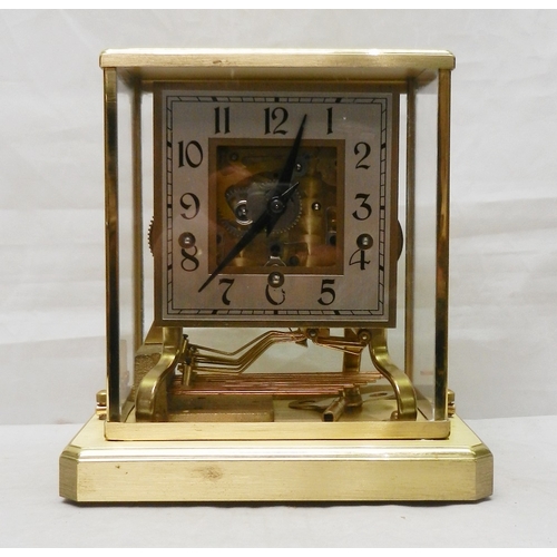 247 - A skeleton mantel clock in a brass case with perspex glazing, the German Shatz 7 jewel movement stri... 