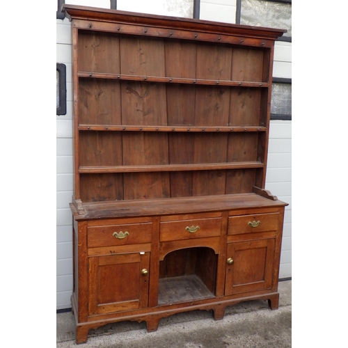 An oak dresser & rack with dog kennel centre, worm to back boards, 156cm wide