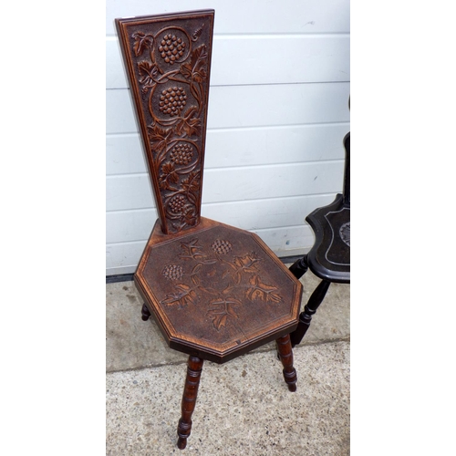 801 - A carved oak spinning chair carved with a grape vine and another (2)