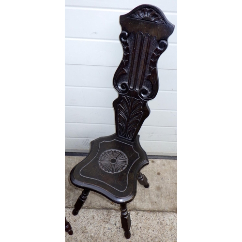 801 - A carved oak spinning chair carved with a grape vine and another (2)