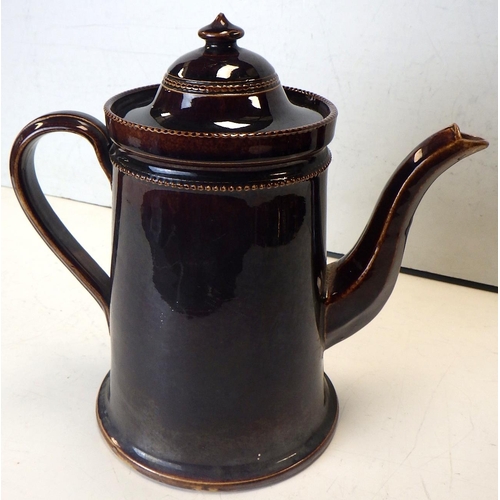 102 - An early 19thC willow pattern jug together with a 19thC hot water pot 22cm tall (2)