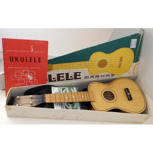 172 - A Suprano ukulele together with a Strong Wind ukulele both with accessories