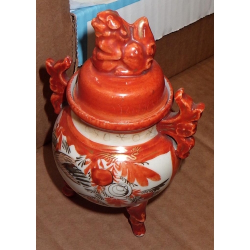 196 - A carved Oriental stand together with two ginger jars and a clock