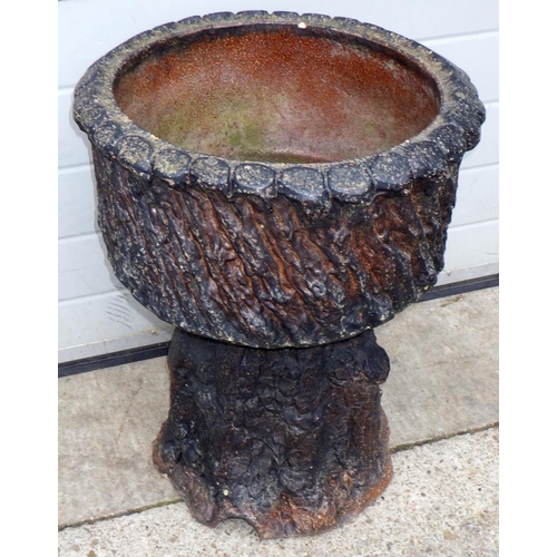 A naturalistic ceramic planter on base, 49cm across, 64cm tall, chipped