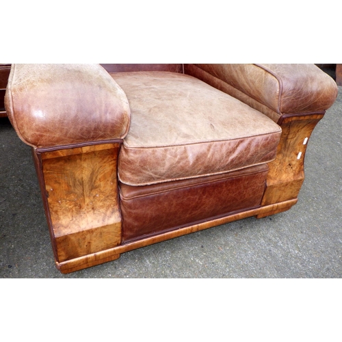 531 - A brown leather upholstered walnut faced three piece suite, settee 190cm wide, springs a/f, leather ... 