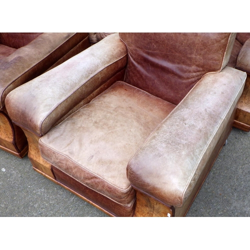 531 - A brown leather upholstered walnut faced three piece suite, settee 190cm wide, springs a/f, leather ... 