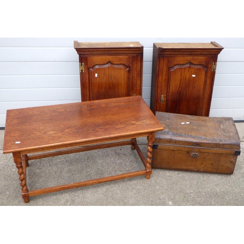 535 - A barleytwist oak coffee table, metal trunk and two hanging cupboards, corners cut (4)