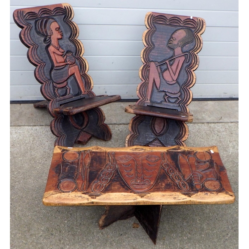 536 - Two African carved chairs and a coffee table (3)