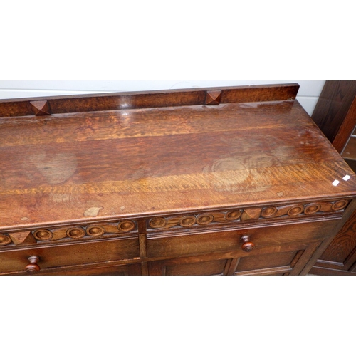 545 - An oak sideboard together with a bookcase with leaded glass doors (2)