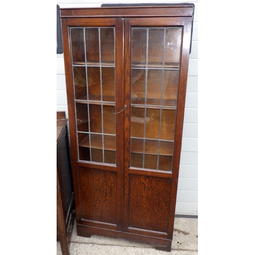 545 - An oak sideboard together with a bookcase with leaded glass doors (2)