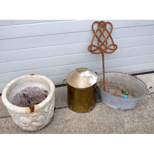 548 - A concrete garden planter, brass coal bucket, galvanized tub and a carpet beater (4)