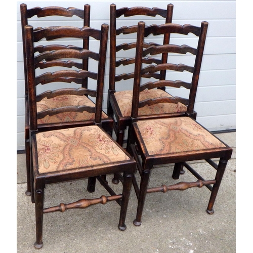 550 - A set of four oak ladderback chairs