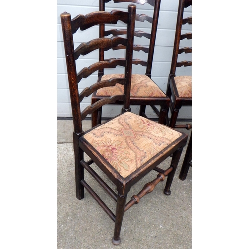 550 - A set of four oak ladderback chairs