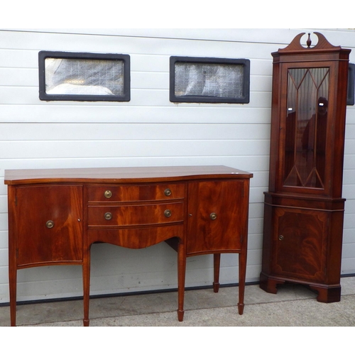 552 - A reproduction mahogany serpentine fronted sideboard, missing one ring together with a tall corner c... 