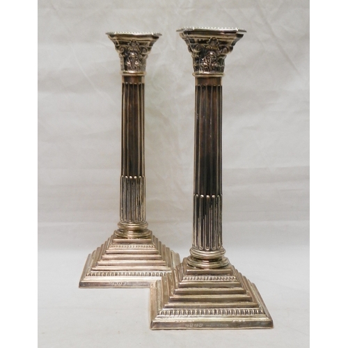 10 - A pair of Corinthian column candlesticks, silver, late 20th cent.