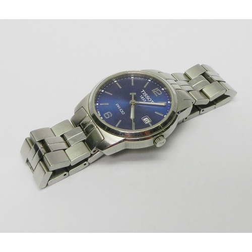 3 - A Tissot PR100 Quartz bracelet watch, stainless steel with a blue dial.  Boxed with papers and spare... 