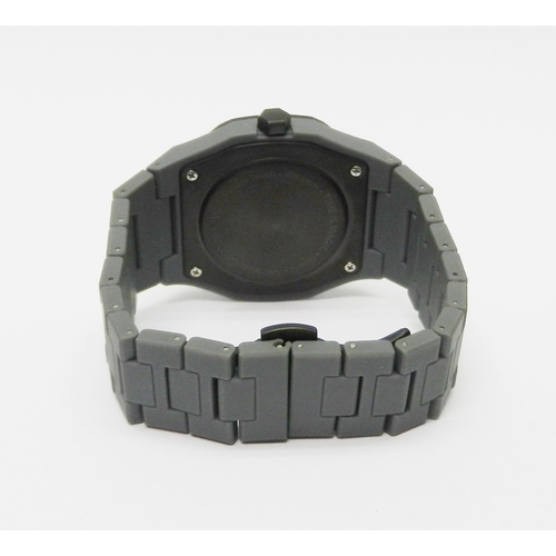 6 - A D1 Milano Neon polycarbon quartz bracelet watch.  40mm across case.  No box or papers or spare lin... 