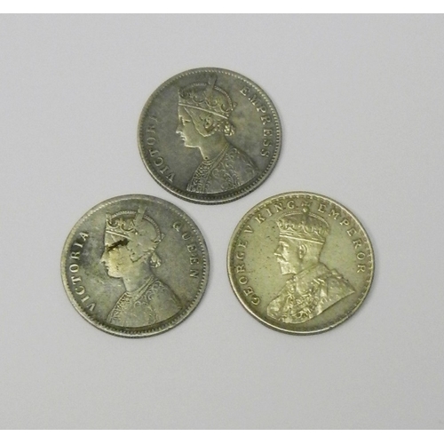 89 - Two Victoria One Rupee coins,1862 and 1877; a George V 1917 One Rupee coin.  (3)