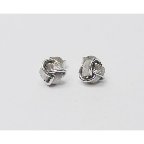 40 - A pair of ribbon knot design stud earrings, 18ct white gold.  Heads 7mm diameter / 1.5g