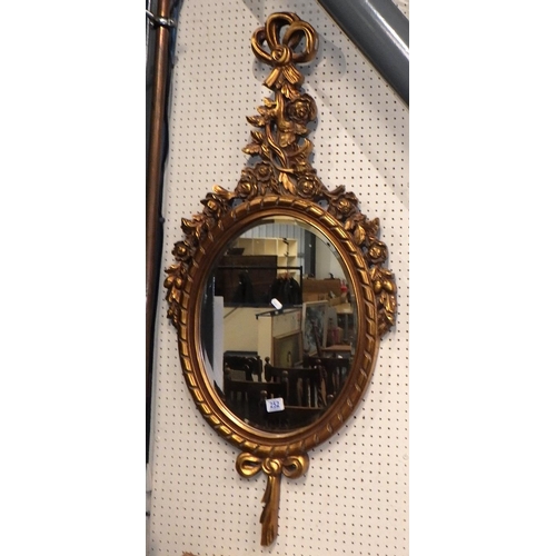 252 - A modern gilt framed bevelled mirror 120cm long