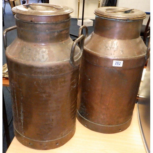 282 - Two large copper & steel churns 56cm tall