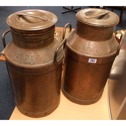 282 - Two large copper & steel churns 56cm tall