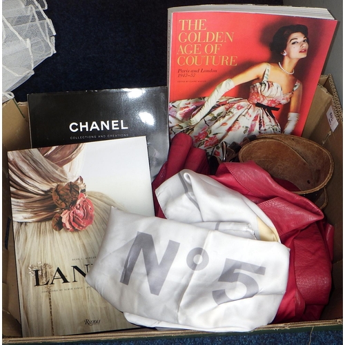 372 - A wedding dress, red leather jacket, fashion books etc