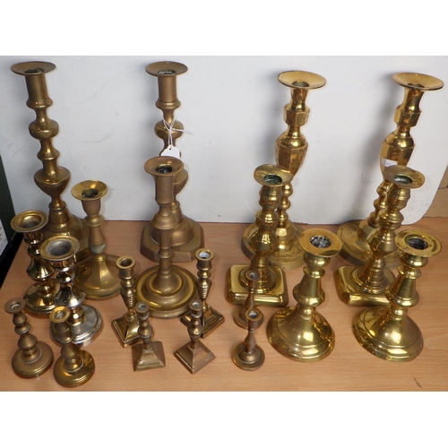 400 - A group of brass candlesticks, some 19thC