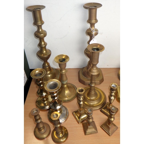 400 - A group of brass candlesticks, some 19thC