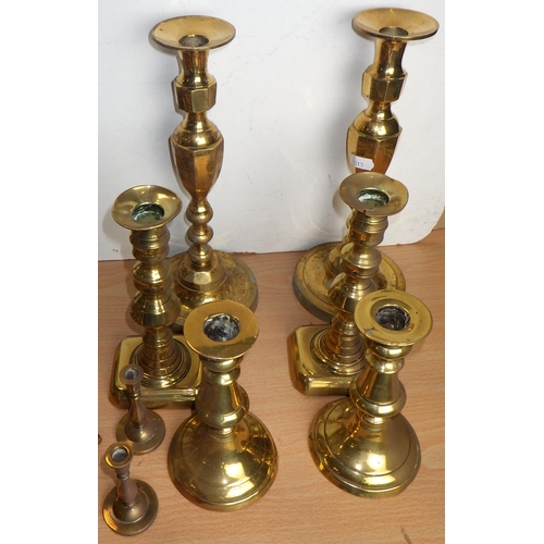 400 - A group of brass candlesticks, some 19thC