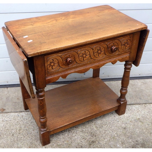 453 - An oak drop leaf side table, 79cm wide