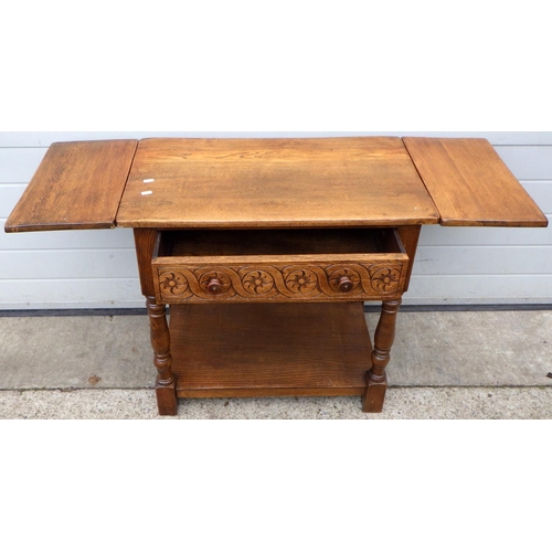 453 - An oak drop leaf side table, 79cm wide