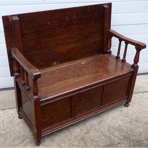 457 - A panelled oak monks bench, 107cm wide