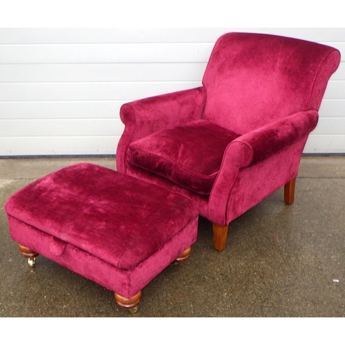 480 - A red upholstered easy chair, together with a footstool, stool with Duresta label (2)