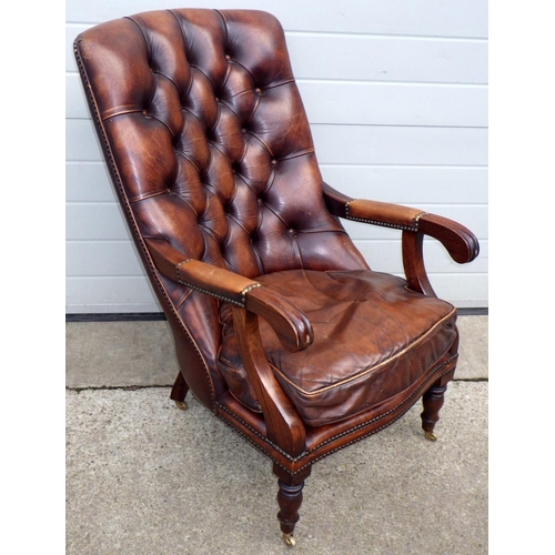 481 - A brown leather button upholstered sling back chair