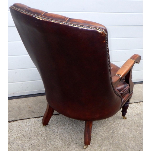 481 - A brown leather button upholstered sling back chair