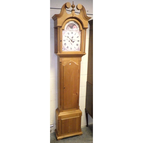 435 - A reproduction pine longcase clock with printed face and battery movement, 229cm tall