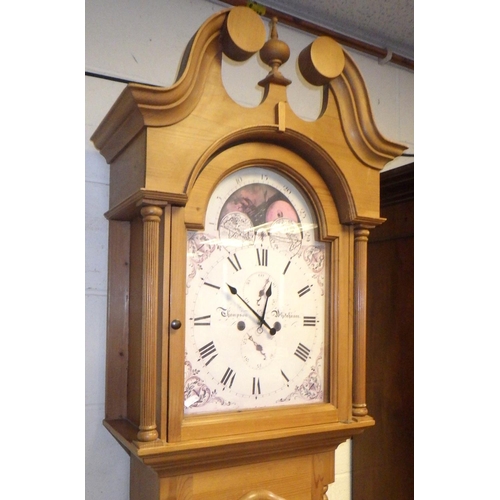 435 - A reproduction pine longcase clock with printed face and battery movement, 229cm tall