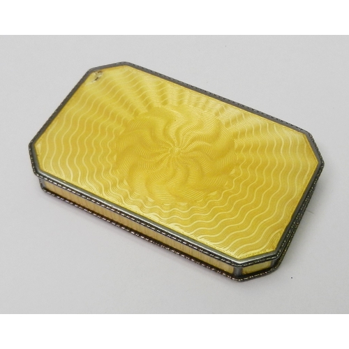 27 - An Austrian snuff box having a sprung hinge lid, white metal marked 900 and enamel on engine-turned ... 