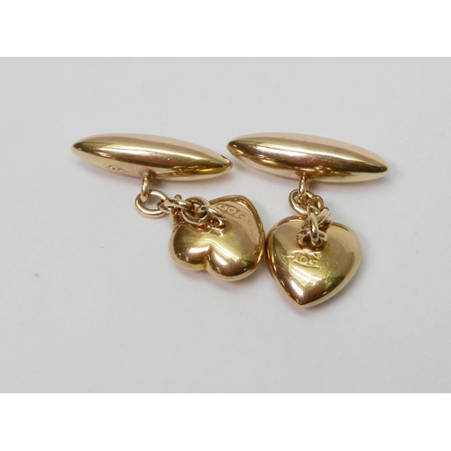 67 - A pair of heart motif chain link cufflinks, yellow metal marked 10ct.