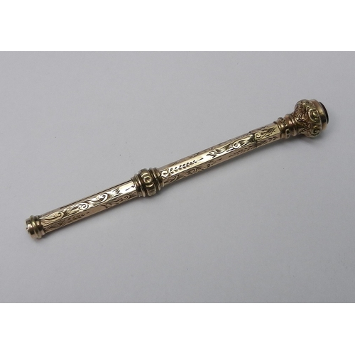 70 - An Edwardian propelling pencil, yellow metal indistinctly marked.  84mm retracted