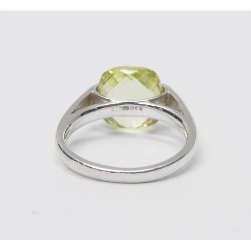 76 - A modern Art Jewellery single stone statement ring, 9ct white gold set with a cushion shaped green c... 