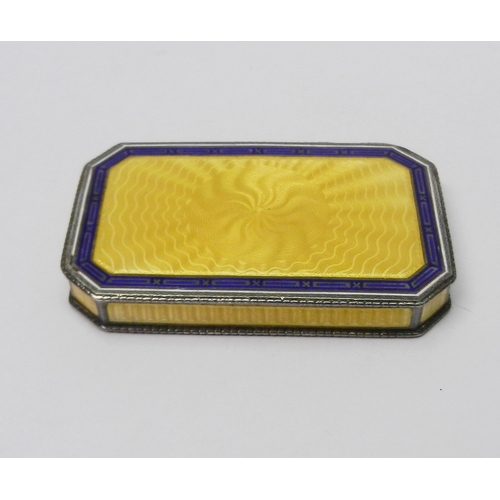 27 - An Austrian snuff box having a sprung hinge lid, white metal marked 900 and enamel on engine-turned ... 