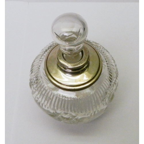 29 - A cut glass scent bottle having a silver collar, London 1912.  135mm tall incl stopper.