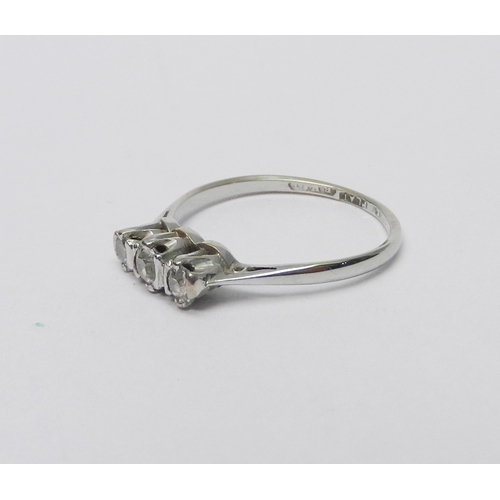 66 - A three stone diamond ring marked 18ct & Plat.