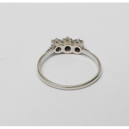 66 - A three stone diamond ring marked 18ct & Plat.