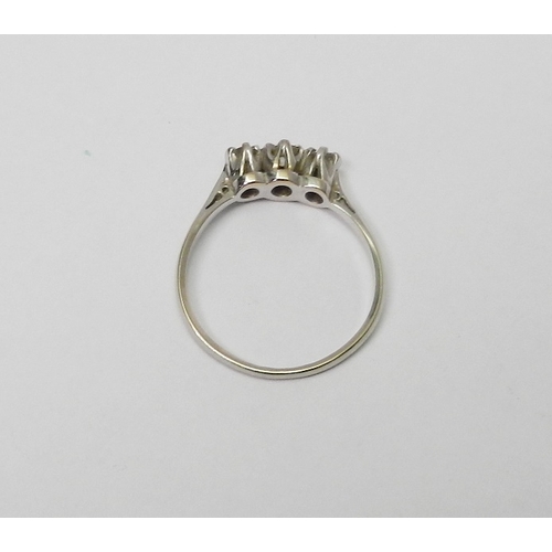 66 - A three stone diamond ring marked 18ct & Plat.