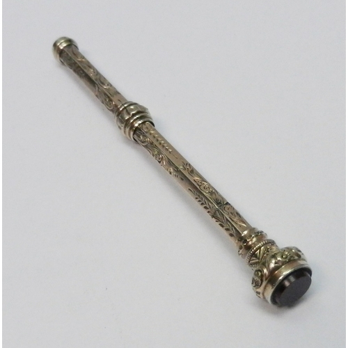 70 - An Edwardian propelling pencil, yellow metal indistinctly marked.  84mm retracted